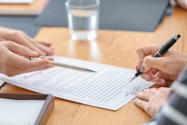 hand signing a document