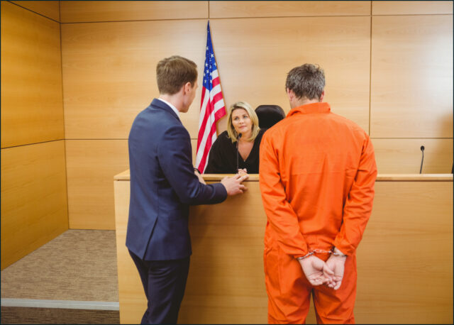 attorney and client in handcuffs