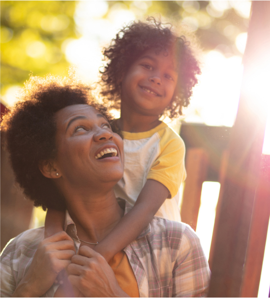 Photo of Boy on Mother's Shoulders