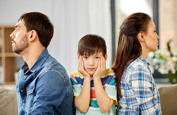 child stuck between two fighting parents, Child Custody Lawyers concept image