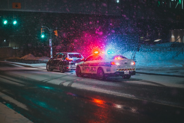 cop car pulling over a vehicle