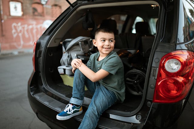 child in back of vehicle