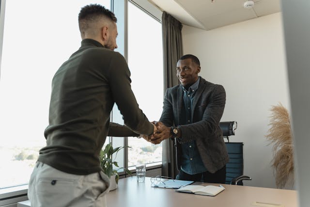 two men shaking hands