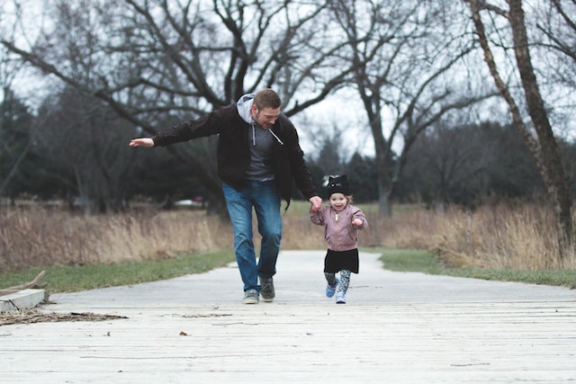 father and child running together