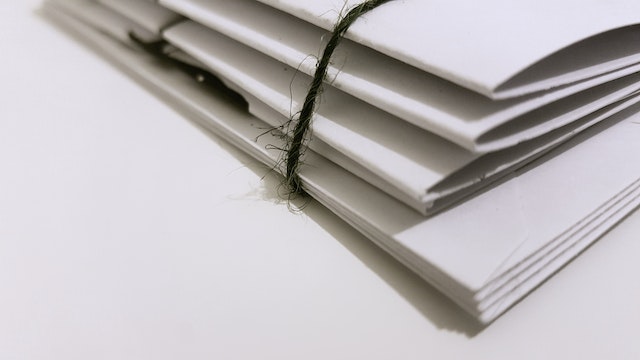 notebooks and papers bound together