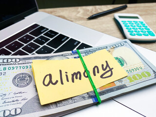 money with note that says alimony