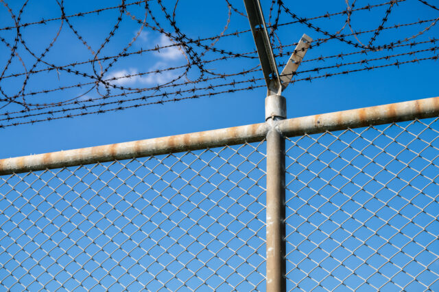 barbed wire fence jail